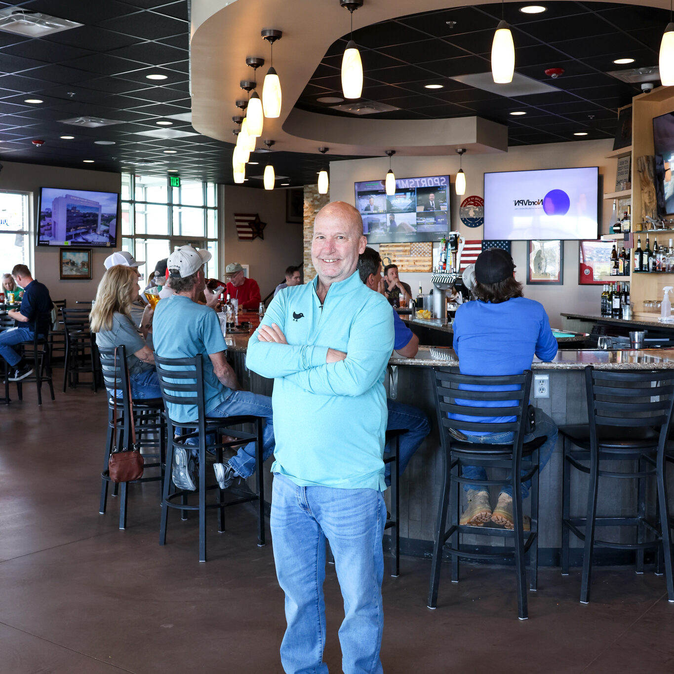 Bob Nobles, owner of Takoda Tavern standing in the middle of the bar area. 