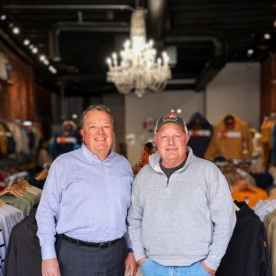 Heath Kinsland, Market President with the owner of Shirt off my back store.