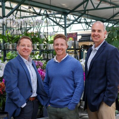 Jeff Walker, Josh Dearmore, and the owner of Veldkamp's Flowers. Jeff and Josh help with the business accounts at the flower shop.